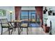 Charming dining area with tiled floors, table set for two, and balcony access with water views at 6279 Sun Blvd # 103, St Petersburg, FL 33715