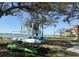 Outdoor area with kayak storage racks near the waterfront and a pathway at 6279 Sun Blvd # 103, St Petersburg, FL 33715