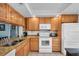 Well-equipped kitchen with modern appliances and granite countertops at 6279 Sun Blvd # 103, St Petersburg, FL 33715