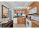 Updated kitchen with granite countertops, white appliances, and glass-front cabinetry at 6279 Sun Blvd # 103, St Petersburg, FL 33715