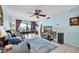 Cozy living room with a large TV, comfortable sofa, and access to a screened-in balcony at 6279 Sun Blvd # 103, St Petersburg, FL 33715