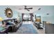 Bright living room features comfortable seating, a ceiling fan, and stunning water views at 6279 Sun Blvd # 103, St Petersburg, FL 33715