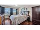 Beautiful main bedroom with wood floors, waterfront views, and coastal-themed decor at 6279 Sun Blvd # 103, St Petersburg, FL 33715