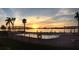 Gorgeous sunset view of the in-ground swimming pool located next to the bay and bridge at 6279 Sun Blvd # 103, St Petersburg, FL 33715