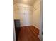 Spacious walk-in closet with built-in shelving and beautiful hardwood flooring for optimal storage at 6279 Sun Blvd # 103, St Petersburg, FL 33715