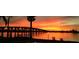 Bay view featuring a bridge and vibrant sunset with seating in the foreground at 6279 Sun Blvd # 103, St Petersburg, FL 33715