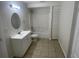 This bathroom features a single sink vanity, toilet, and a shower-tub combo at 6411 26Th W St, Bradenton, FL 34207