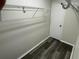 This closet features wire shelving and dark wood-look vinyl plank flooring at 6411 26Th W St, Bradenton, FL 34207