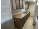 Kitchen features ample cabinet space, counter tops, and tile flooring at 6411 26Th W St, Bradenton, FL 34207