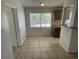 Eat-in kitchen with tile flooring and a window to the backyard at 6411 26Th W St, Bradenton, FL 34207