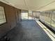 Enclosed porch with screened walls offering a view of the backyard at 6411 26Th W St, Bradenton, FL 34207