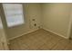 Neutral room featuring tile floors, a window, and utility connections on the wall at 6411 26Th W St, Bradenton, FL 34207