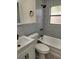 Bathroom featuring modern fixtures and gray wall tile at 6646 Del Prado Ter, New Port Richey, FL 34652