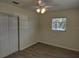 Cozy bedroom with neutral walls and laminate flooring at 6646 Del Prado Ter, New Port Richey, FL 34652