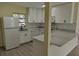 Well-equipped kitchen with updated appliances and ample counter space at 6646 Del Prado Ter, New Port Richey, FL 34652