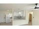 Bright kitchen with granite countertops and stainless steel appliances at 6646 Del Prado Ter, New Port Richey, FL 34652