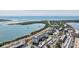 Coastal aerial view of condo community near Gulf beaches with a pier for boating and fishing at 7 Elgin Pl # 510, Dunedin, FL 34698