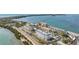 Aerial view of condo buildings, parking lots and the waterway leading to the Gulf at 7 Elgin Pl # 510, Dunedin, FL 34698