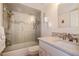 Bathroom with a tiled shower and modern vanity at 7 Elgin Pl # 510, Dunedin, FL 34698
