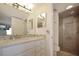 Bathroom featuring a shower and modern vanity at 7 Elgin Pl # 510, Dunedin, FL 34698