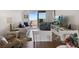 Comfortable living room featuring stylish decor, balcony access, and scenic water views for relaxation at 7 Elgin Pl # 510, Dunedin, FL 34698