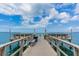 Pier with benches offers a waterfront view for fishing, boating, or to enjoy the scenery at 7 Elgin Pl # 510, Dunedin, FL 34698