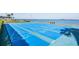 Community shuffleboard court with ocean views and benches; perfect for outdoor recreation and relaxation at 7 Elgin Pl # 510, Dunedin, FL 34698