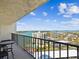 Balcony with seating overlooking a waterfront view of the community and swimming pool at 736 Island Way # 1101, Clearwater Beach, FL 33767