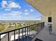Balcony with furniture overlooking waterfront community, tennis courts, and parking at 736 Island Way # 1101, Clearwater Beach, FL 33767