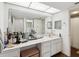 Bathroom with a large mirror, vanity, and ample counter space for accessories at 736 Island Way # 1101, Clearwater Beach, FL 33767