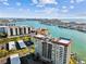 High-rise building with water view featuring balconies, parking and boat docks at 736 Island Way # 1101, Clearwater Beach, FL 33767
