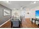 Spacious dining room featuring hardwood floors, modern lighting, and stylish gray and white decor at 736 Island Way # 1101, Clearwater Beach, FL 33767