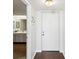 Clean, white entryway with a white door, leading to a bathroom with a vanity at 736 Island Way # 1101, Clearwater Beach, FL 33767