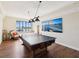 Recreation room featuring a ping pong table, wood floors, and a scenic view from the window at 736 Island Way # 1101, Clearwater Beach, FL 33767