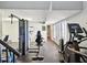 Community gym with multiple weight machines, stationary bikes and black rubber flooring at 736 Island Way # 1101, Clearwater Beach, FL 33767