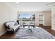 Community living room featuring modern sofas, a glass coffee table, a view of the ocean, and hardwood floors at 736 Island Way # 1101, Clearwater Beach, FL 33767