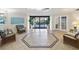 Lobby with tiled floors, comfortable seating and double door entryway with plants at 736 Island Way # 1101, Clearwater Beach, FL 33767