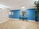 Lobby area showcasing vibrant blue walls, tiled floor, and decorative console table at 736 Island Way # 1101, Clearwater Beach, FL 33767