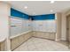Mailbox area featuring numerous mailboxes with storage and a pop of blue accent wall at 736 Island Way # 1101, Clearwater Beach, FL 33767