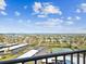 Scenic waterfront view showcasing the neighborhood with tennis courts and parking spots at 736 Island Way # 1101, Clearwater Beach, FL 33767