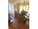 Dining room area with a glass table, elegant chairs, and decorative floral arrangement at 7435 46Th N Ave, St Petersburg, FL 33709