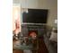 Living room showcasing decorative fireplace, television, and comfortable seating area at 7435 46Th N Ave, St Petersburg, FL 33709