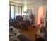 Inviting living room featuring hardwood floors, comfortable seating, and doorway to the bedroom at 7435 46Th N Ave, St Petersburg, FL 33709