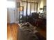 Bright living room with hardwood floors, comfortable seating, and natural light at 7435 46Th N Ave, St Petersburg, FL 33709