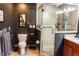 Updated bathroom with a glass door shower, updated vanity, stylish decor, and a modern commode at 750 4Th S Ave # 403C, St Petersburg, FL 33701
