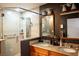 Modern bathroom with a dual sink vanity with granite countertop and a spacious glass door shower at 750 4Th S Ave # 403C, St Petersburg, FL 33701