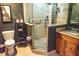 Stylish bathroom featuring a glass door shower with multi-jet showerhead, updated vanity and commode at 750 4Th S Ave # 403C, St Petersburg, FL 33701