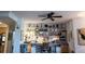 Bright and airy living room with a well-lit desk area featuring display shelving and ample storage at 750 4Th S Ave # 403C, St Petersburg, FL 33701