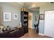 Cozy living room with dark wood cabinets and shelves, neutral walls, and coastal artwork at 750 4Th S Ave # 403C, St Petersburg, FL 33701
