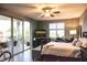 Bright primary bedroom featuring comfortable furnishings and an outdoor balcony at 750 4Th S Ave # 403C, St Petersburg, FL 33701